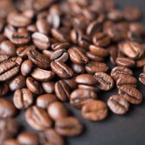 Close-up of glossy roasted coffee beans representing Kiaruthi Nyeri AA