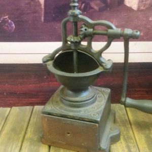 Manual crank coffee grinder with a cast conical grinding bowl