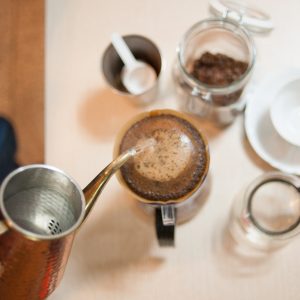 Conical single-hole pour-over dripper with spiral internal ribs, brewing coffee